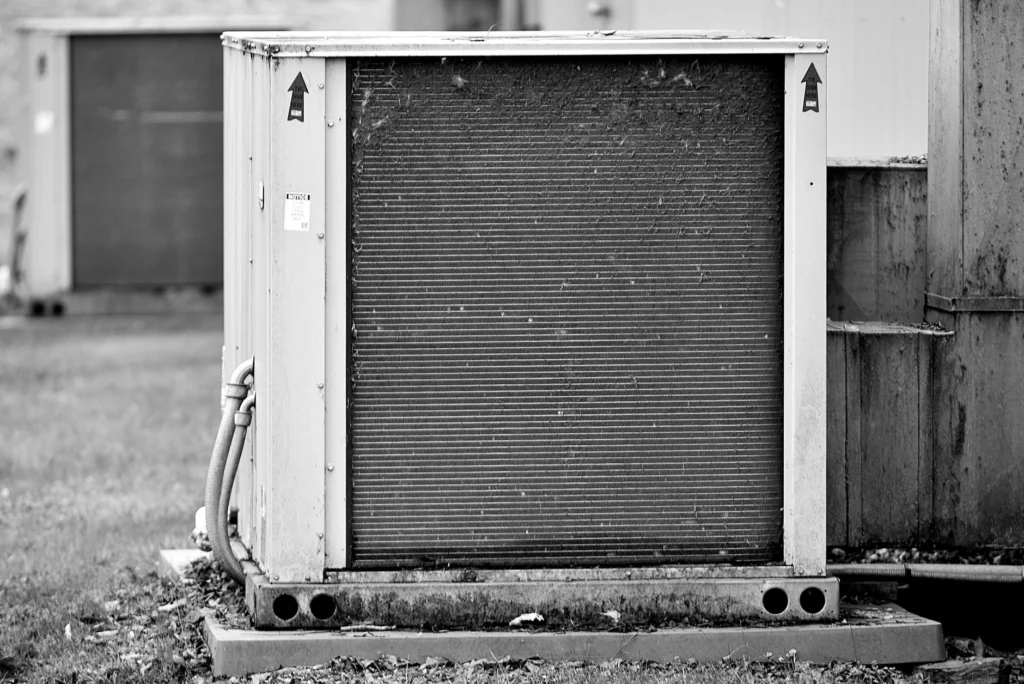 Close-up of an AC coil and metal fins before deep cleaning