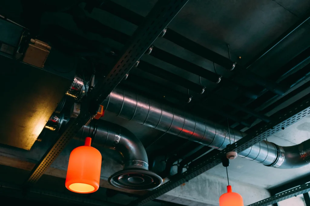 Exposed supply and return air ducts on a ceiling