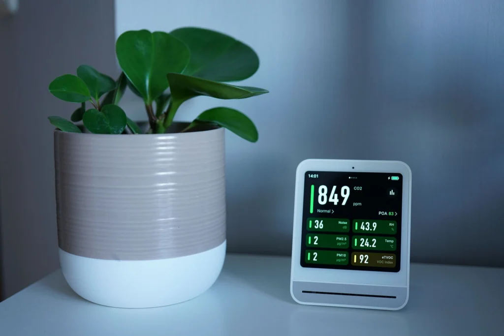 Indoor air quality monitor showing PM2.5 and CO2 levels